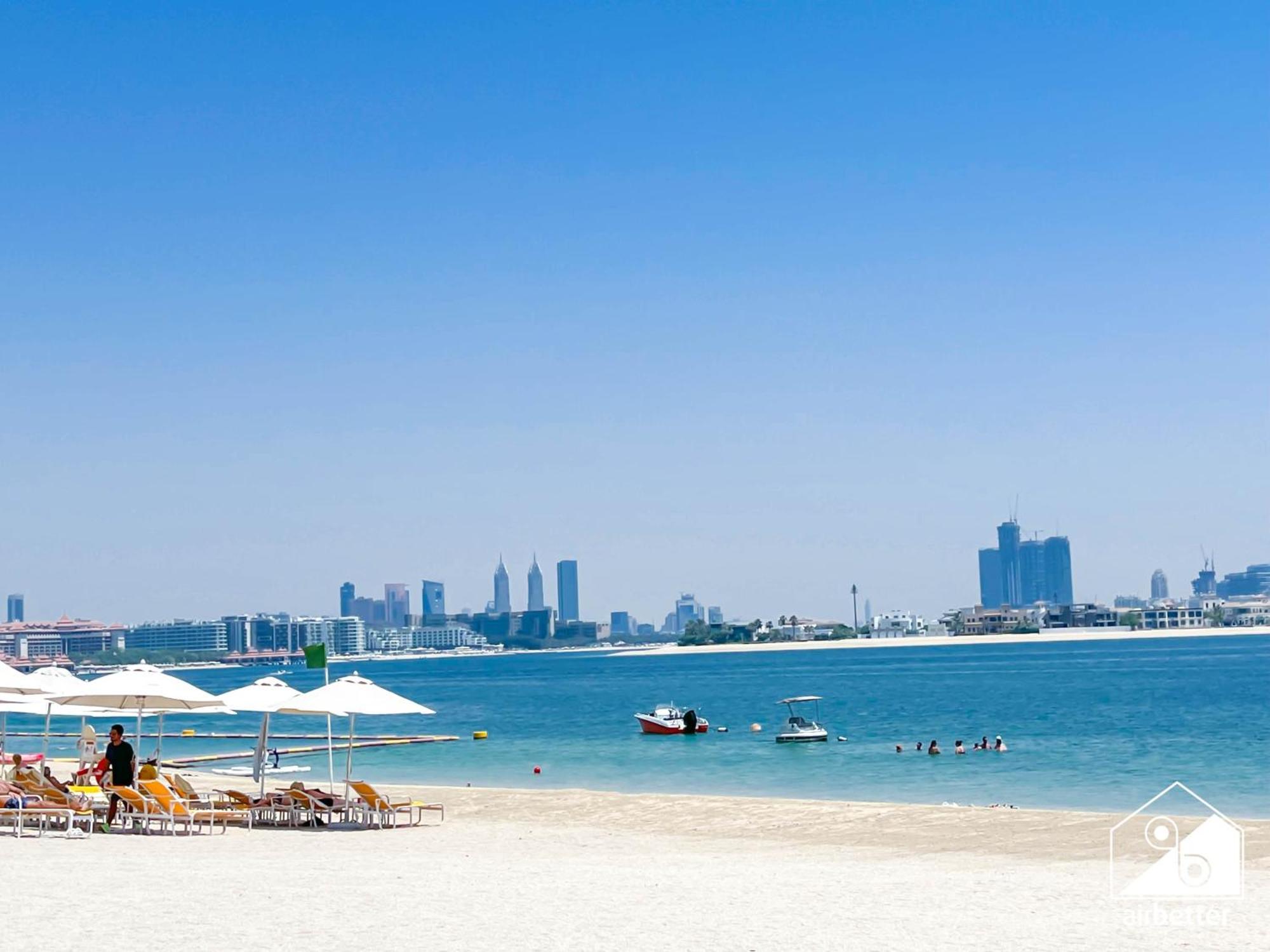 Seafront Serenity Palm Escape With Pool Access Appartement